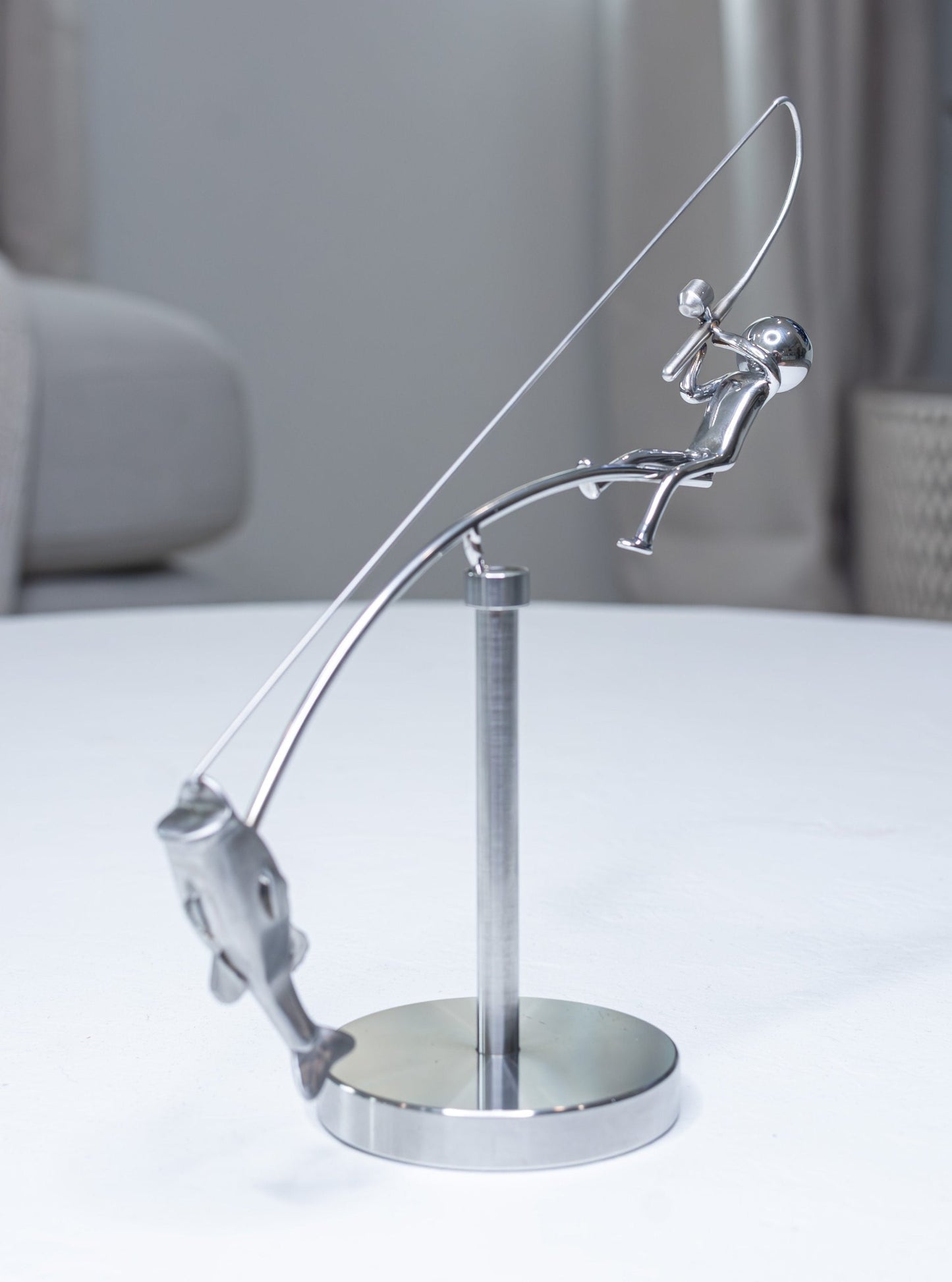 Balanssculptuur van de Visser